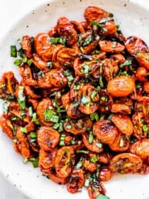 Roasted Cherry Tomatoes piled high in a white bowl.