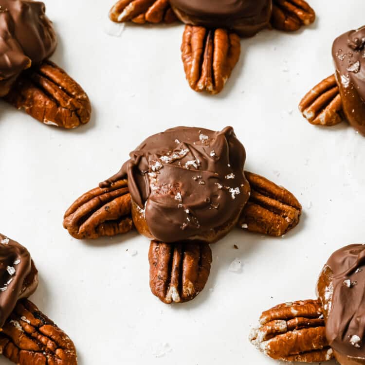 Homemade Chocolate Turtles with bacon on parchment paper.