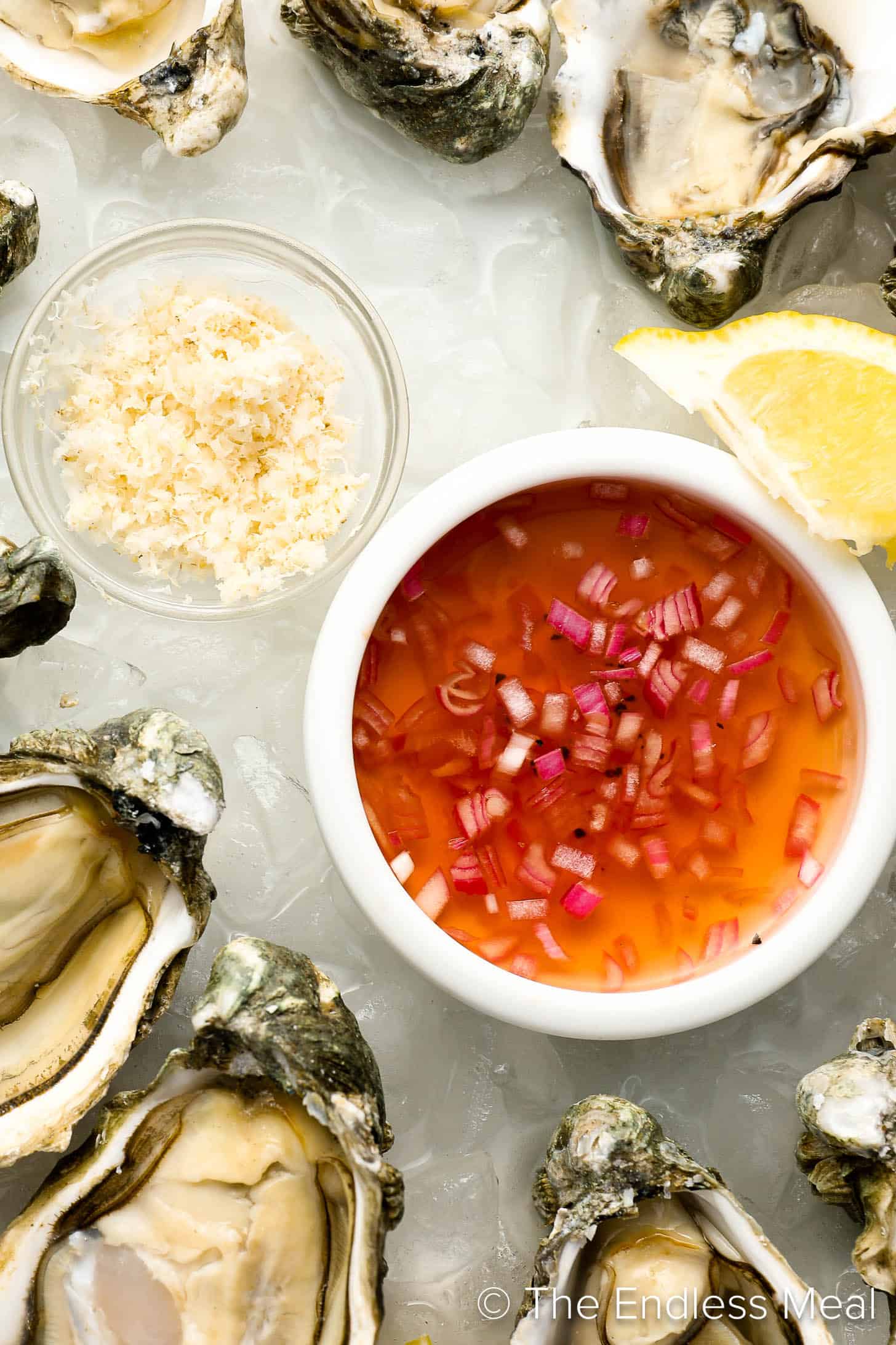 This Champagne Mignonette Recipe on a serving platter with fresh oysters