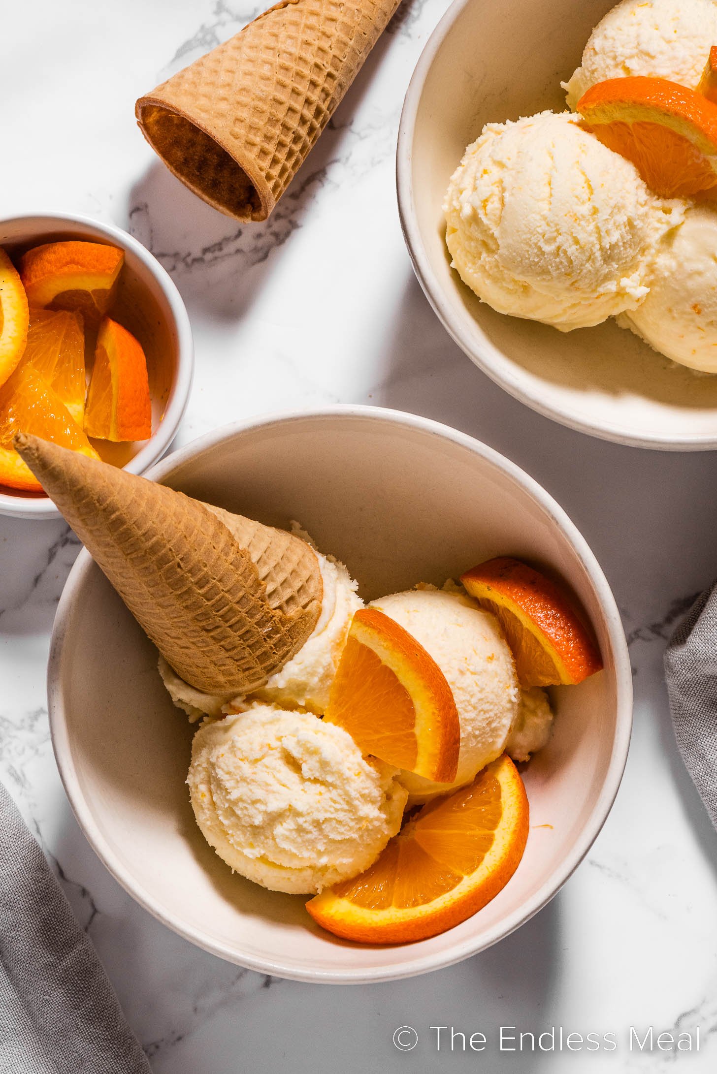 Orange Sherbet with an ice cream cone.
