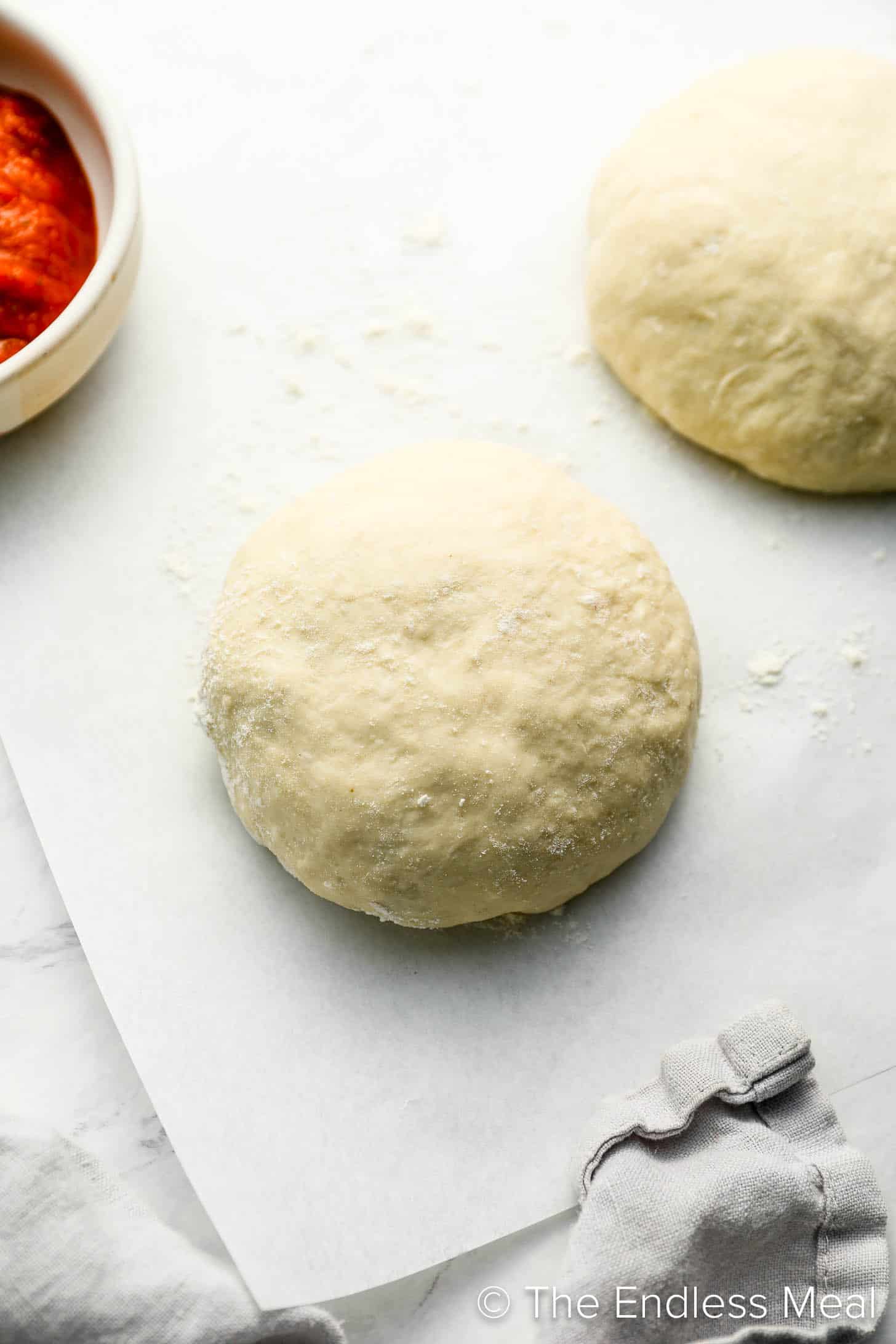 A ball of our Pizza Dough Recipe on a counter