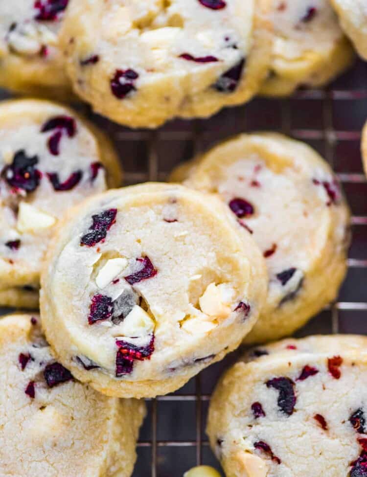 A closeup of a slice and bake white chocolate cranberry cookie.