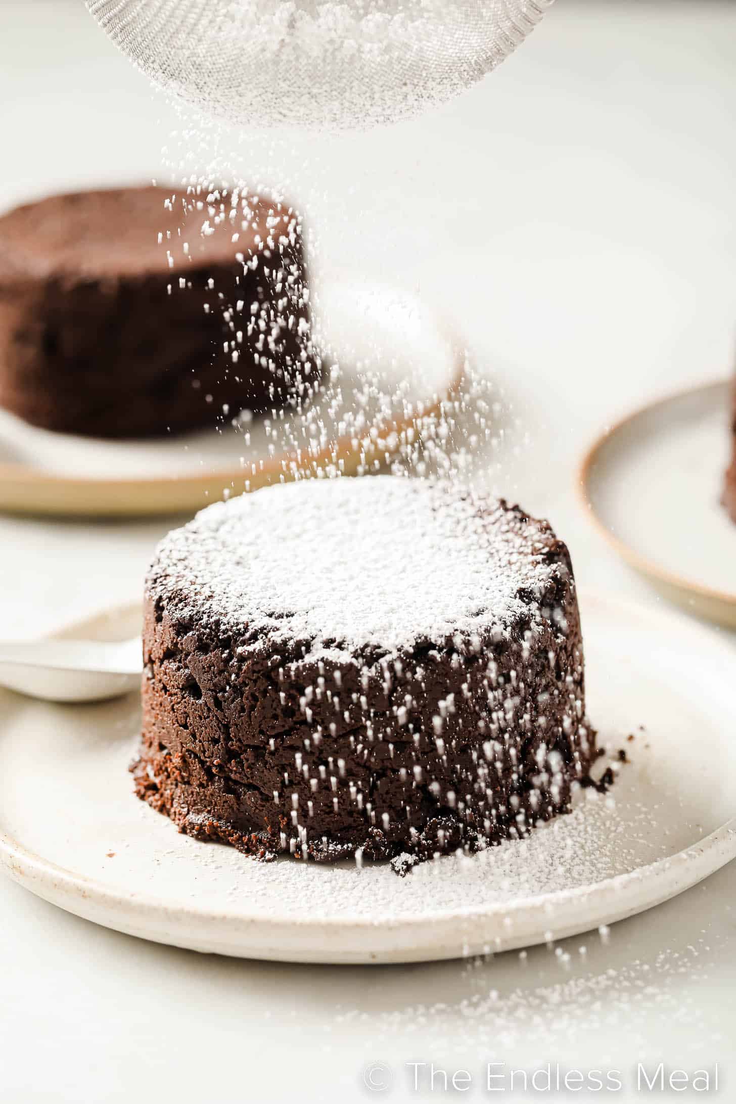 icing sugar dusted over a chocolate lava cake
