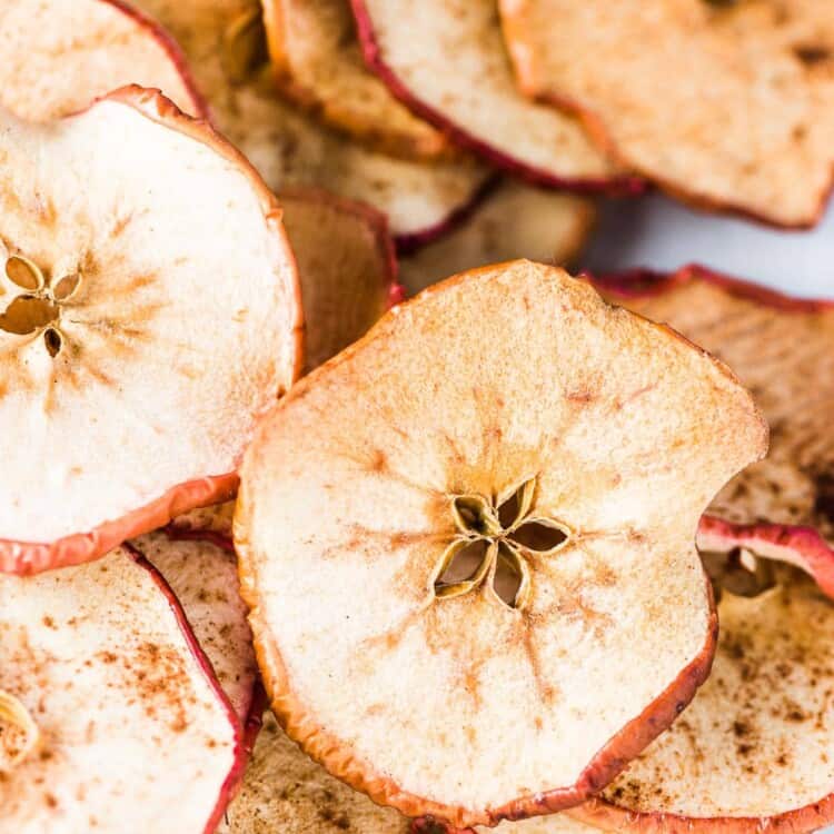 A big pile of baked apple chips.