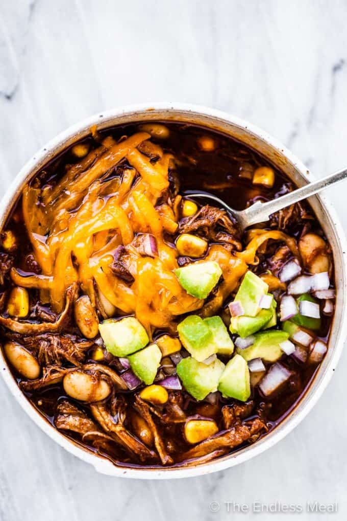 Pulled pork chili in a white bowl
