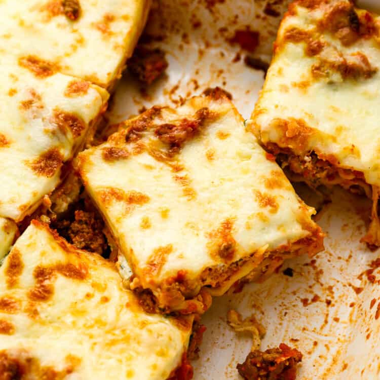 Slices of this Easy Lasagna Recipe in a a baking dish