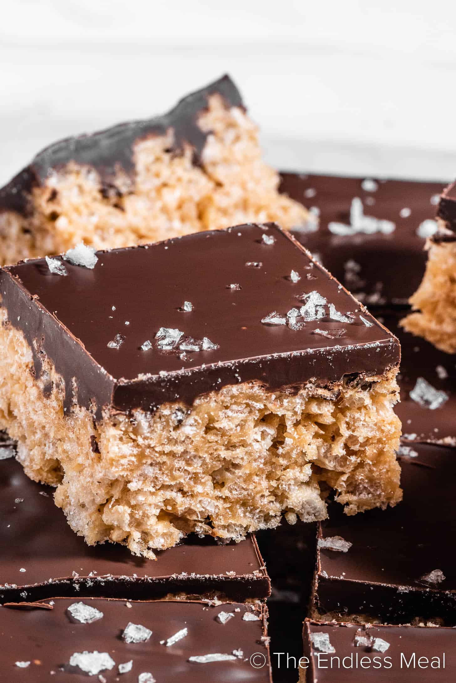 A close up of a Peanut Butter Rice Krispie Treat covered in chocolate