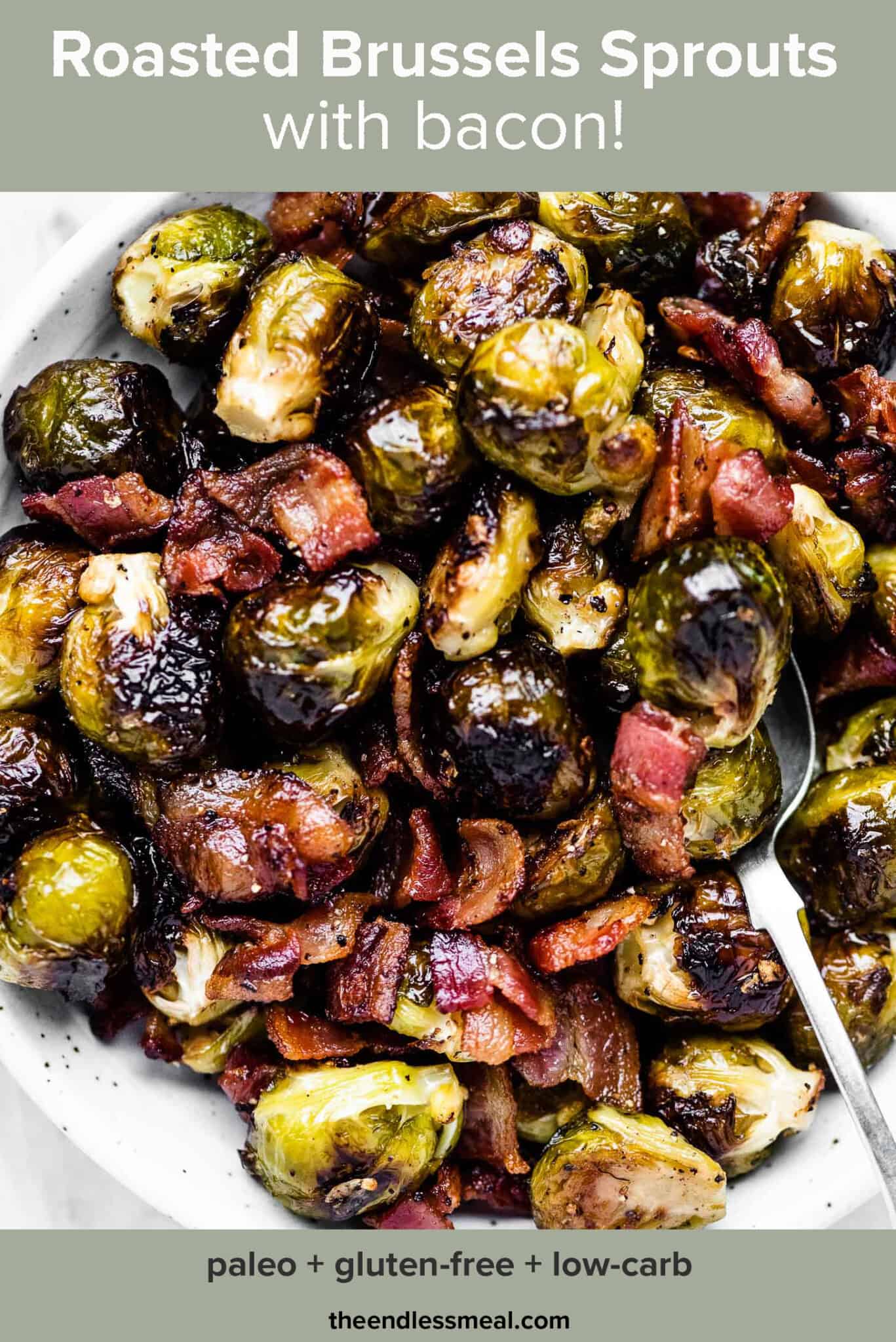 A serving bowl filled with roasted brussels sprouts with bacon and the recipe title on top of the picture.