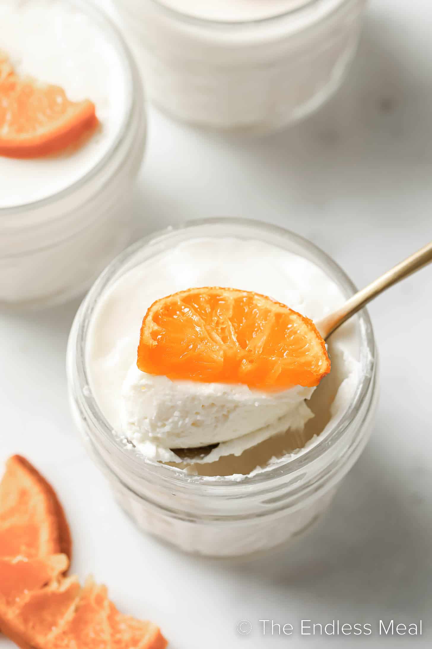 A spoon scooping some Orange Blossom Panna Cotta.