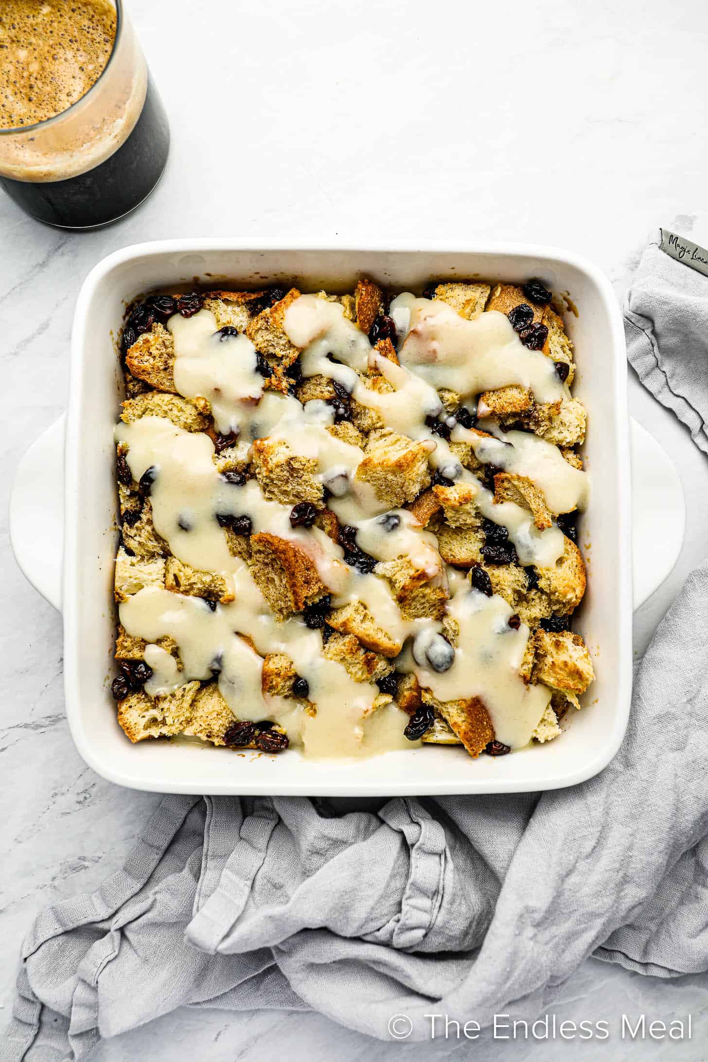 A white baking dish with this easy bread pudding recipe