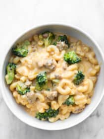 A bowl of broccoli and chorizo macaroni and cheese.