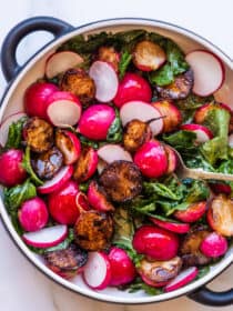 sauteed radishes in a serving dish with a spoon
