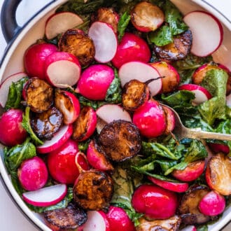 sauteed radishes in a serving dish with a spoon