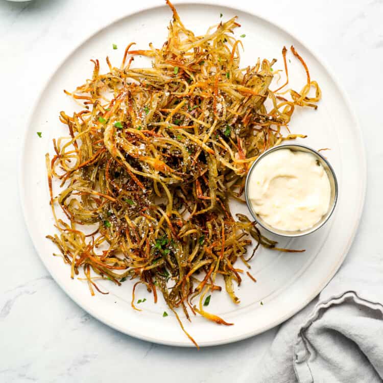 Shoestring Fries on a white dinner plate.