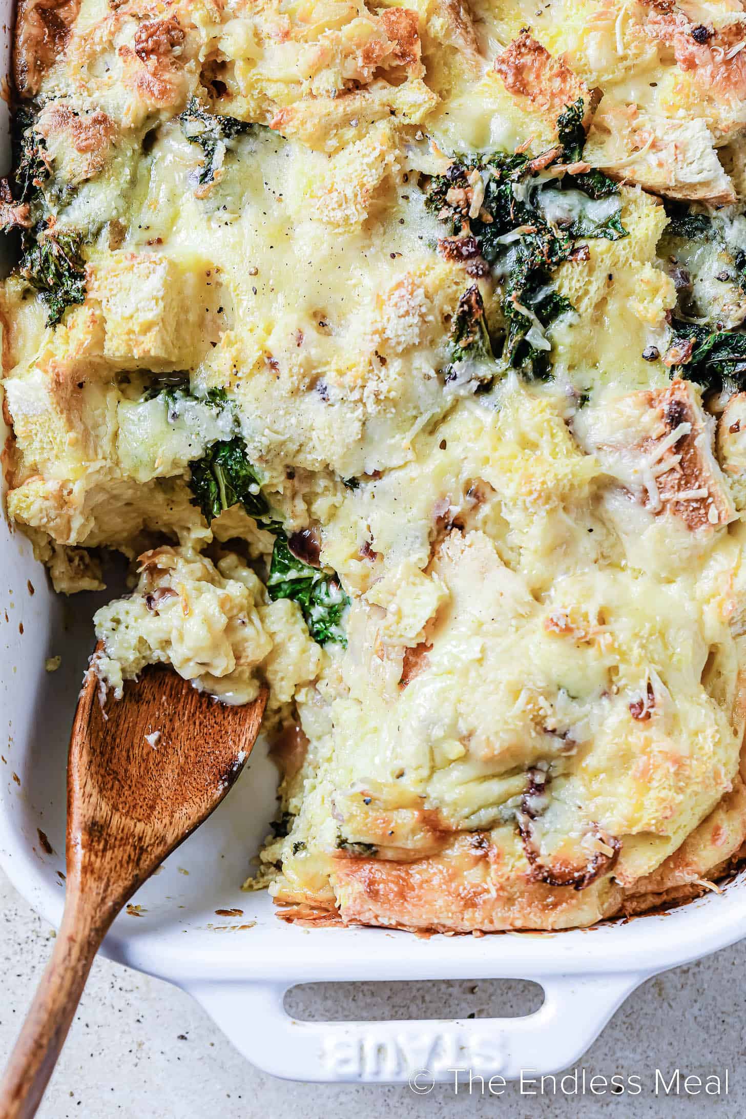 Vegetarian Cheese and Kale Strata in a baking dish