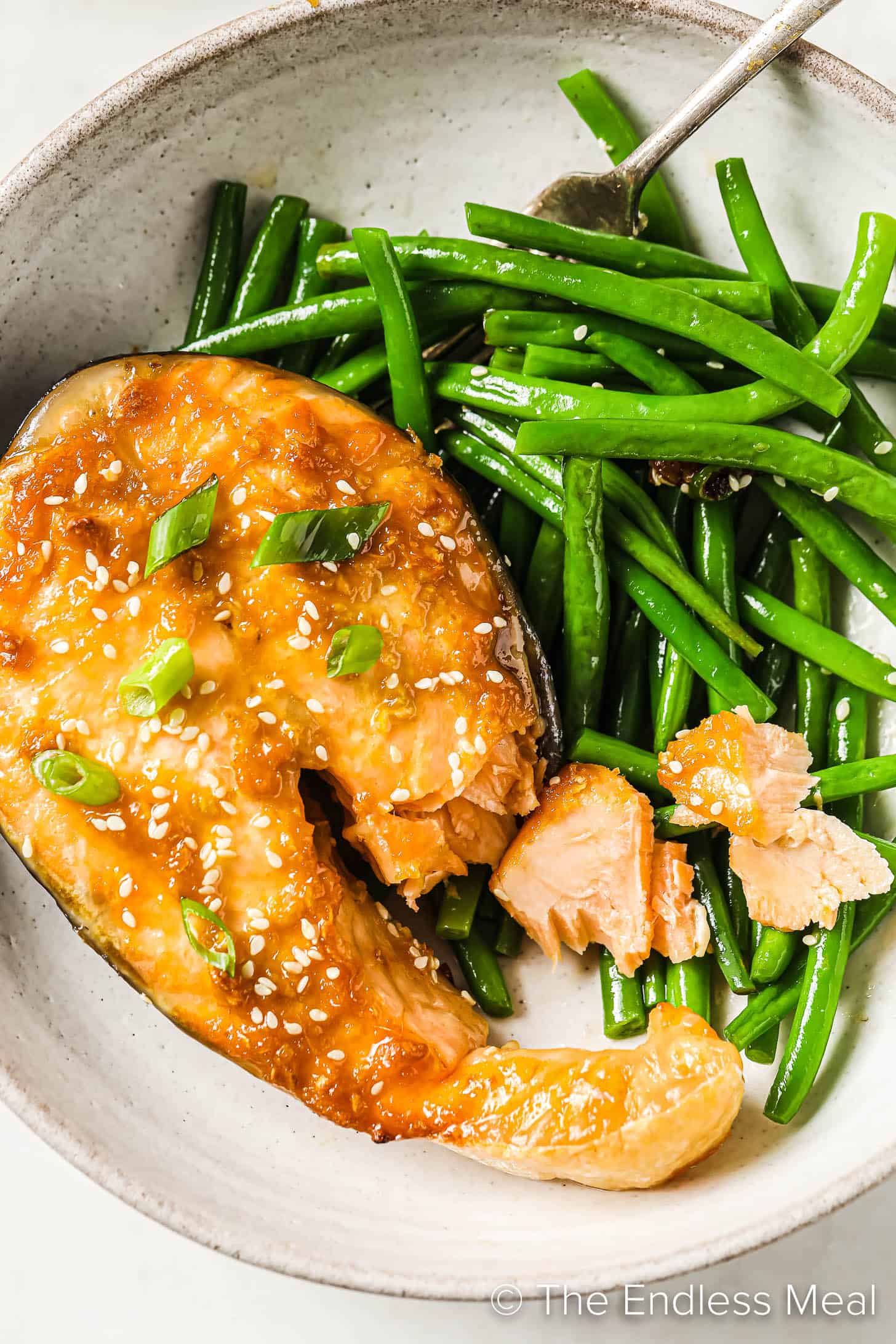 salmon steaks with miso on a plate with green beans