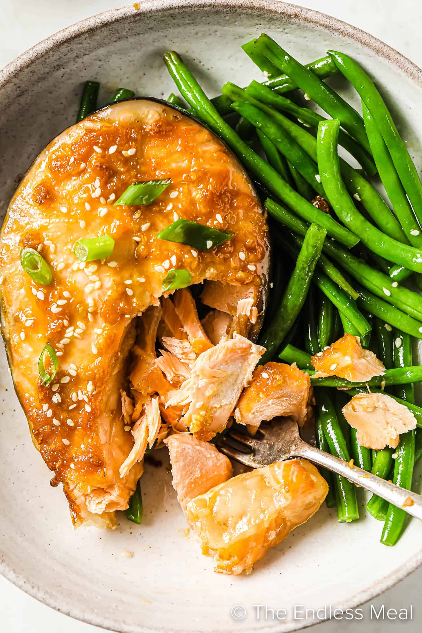 Ginger Miso Salmon Steaks on a plate with green beans