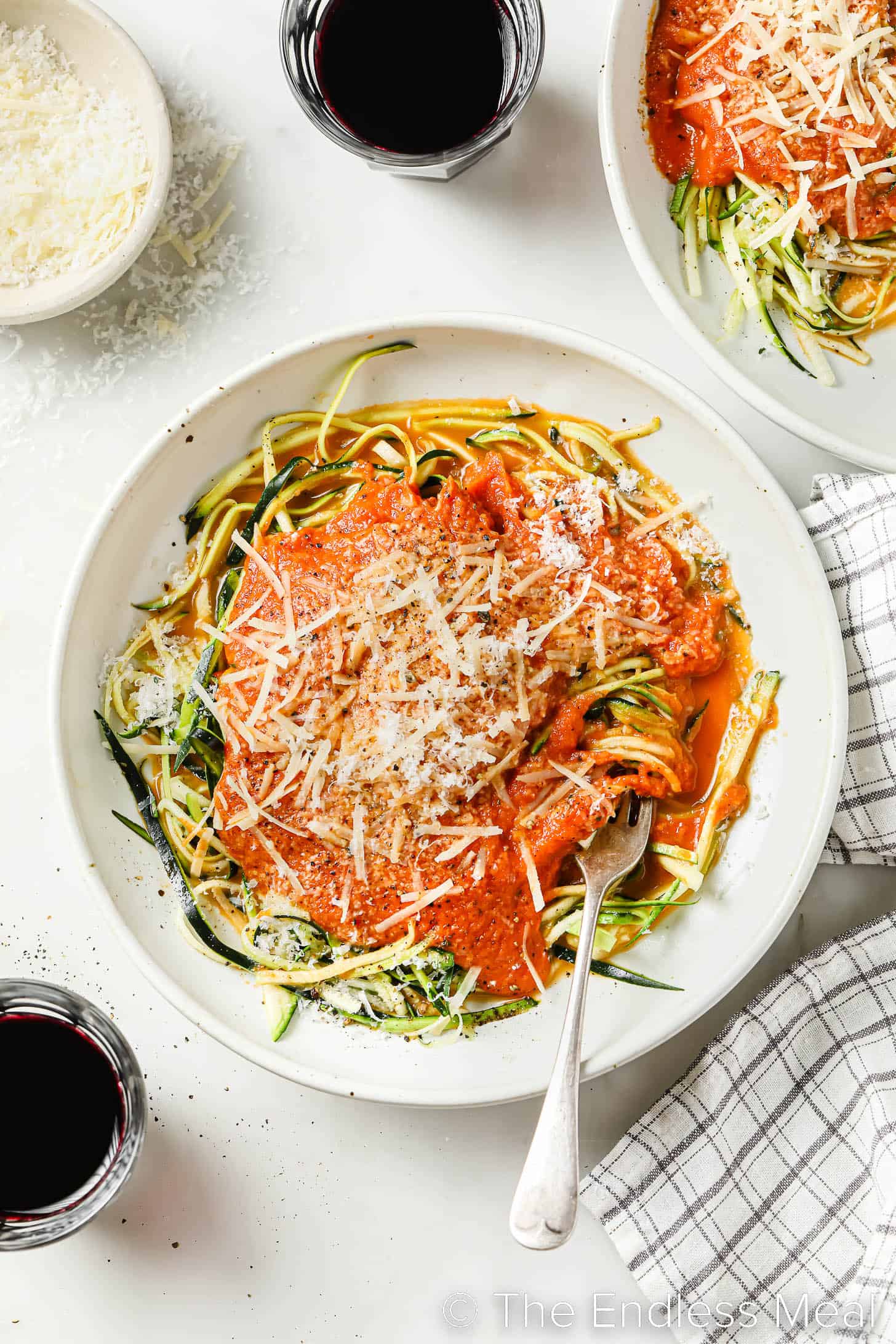 looking down on zucchini spaghetti with tomato sauce in a bowl