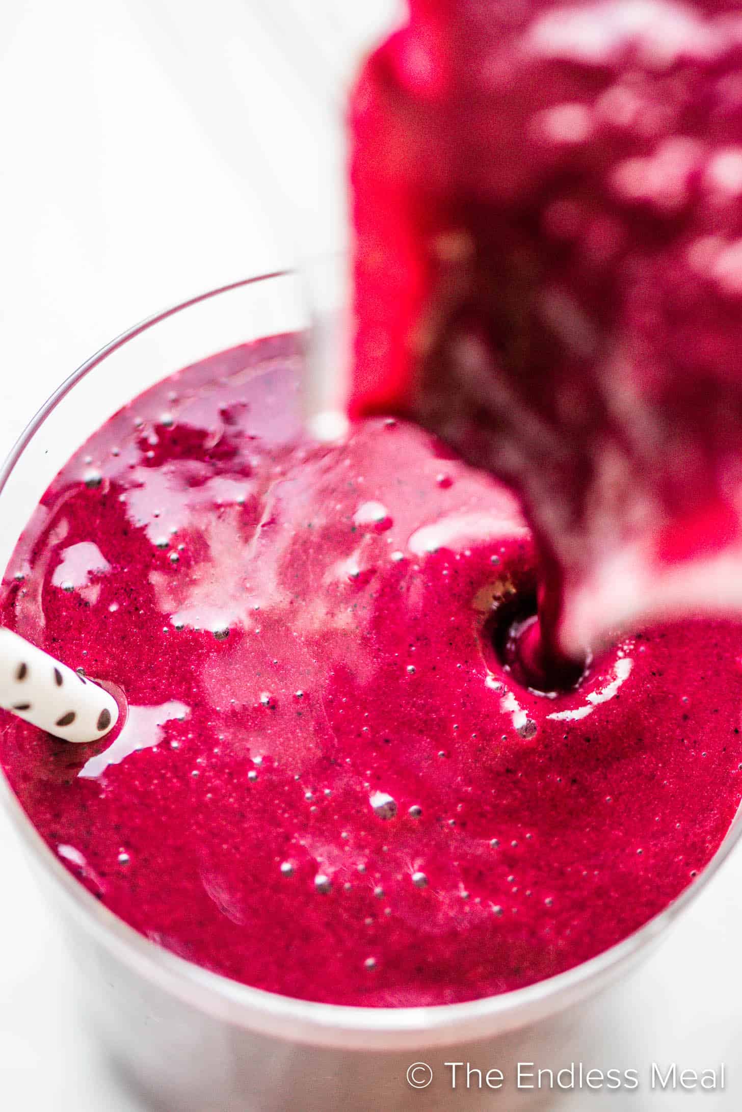 A Beet Smoothie being poured into a glass