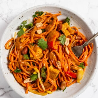 A bowl of Carrot Noodles with peanut sauce