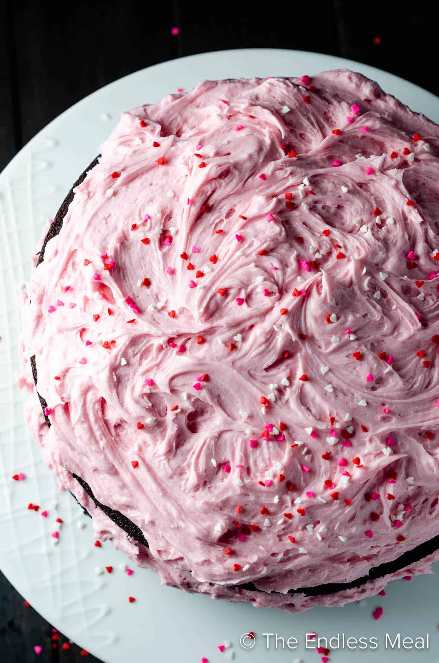 A close up of pink frosting on a beet chocolate cake