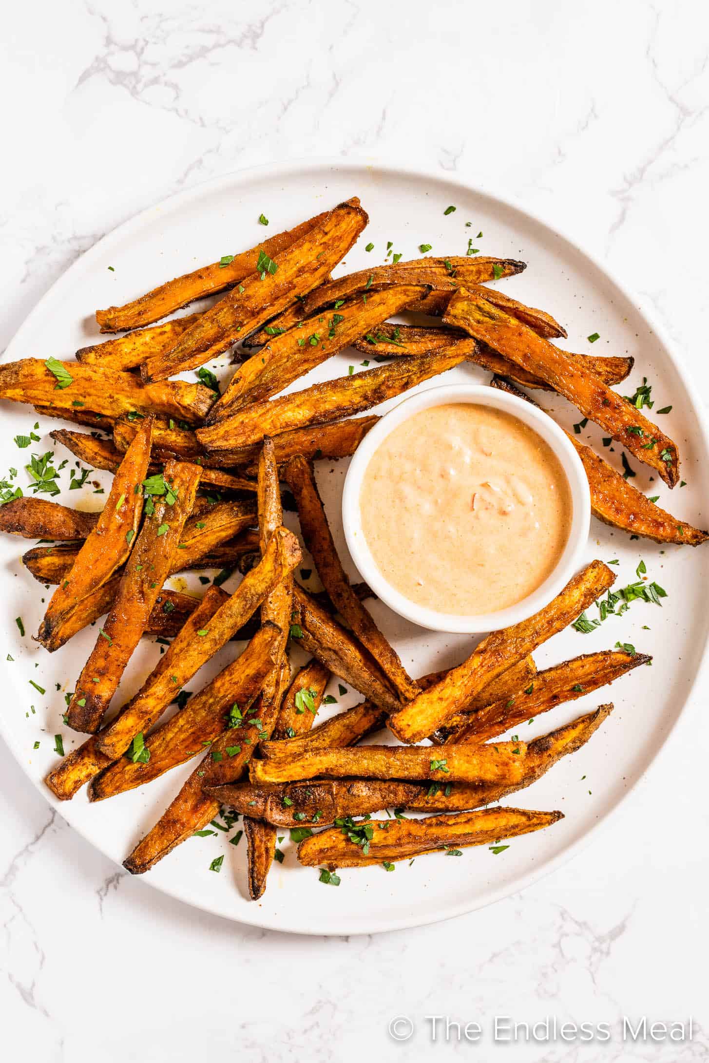 a plate of Spicy Sweet Potato Fries with spicy dip