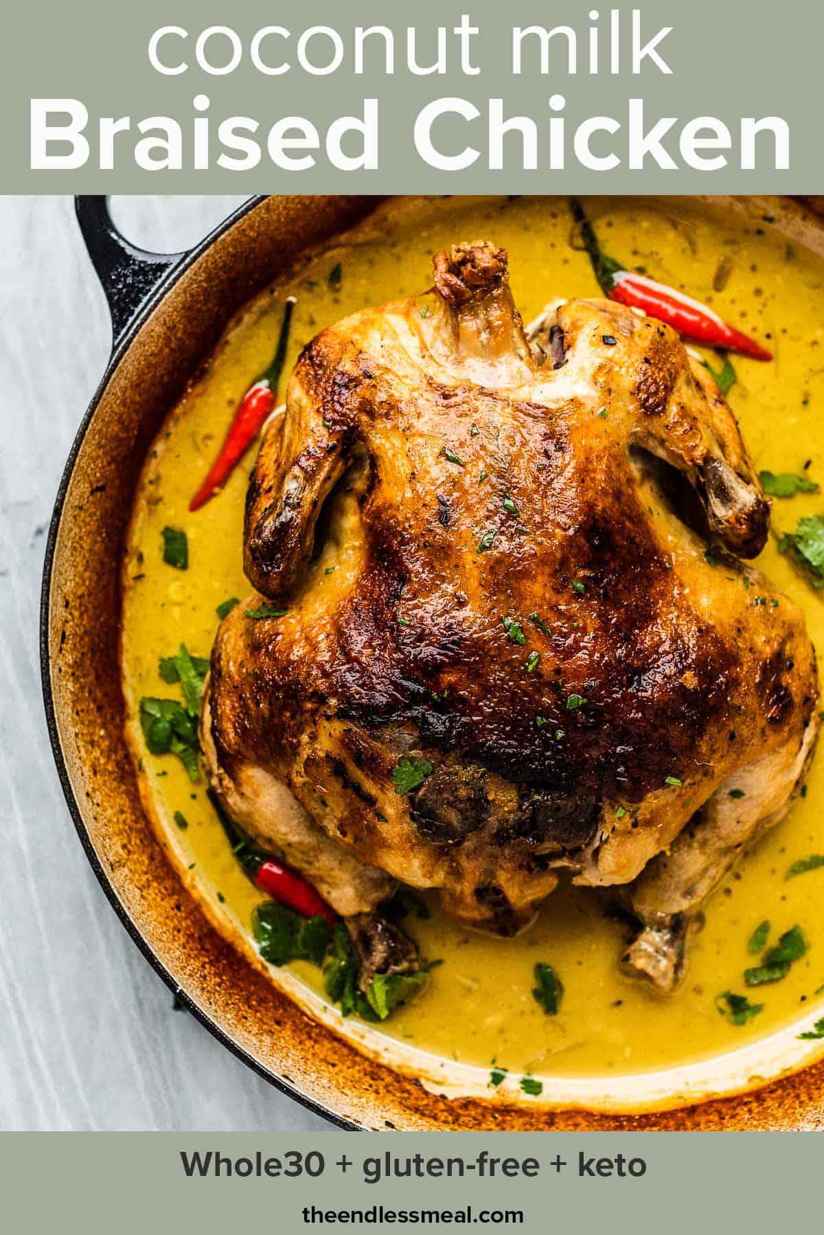 Coconut milk braised chicken in a pan with Thai curry sauce and the recipe title on top of the picture.