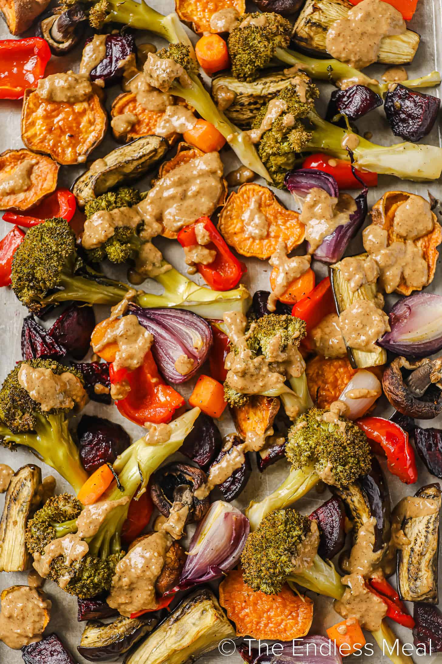a close up of our roasted vegetable dinner recipe on a baking sheet