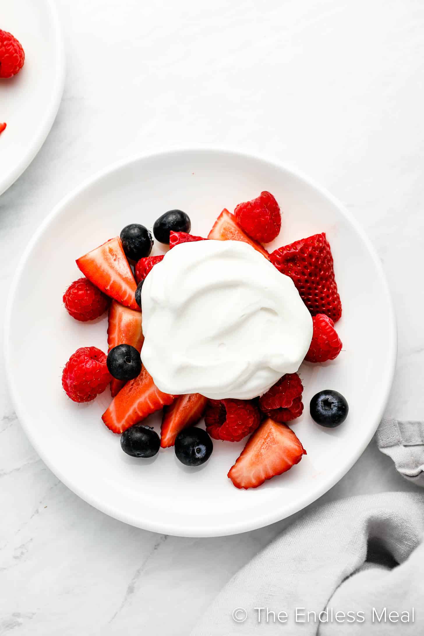 Berries topped with whipped coconut cream
