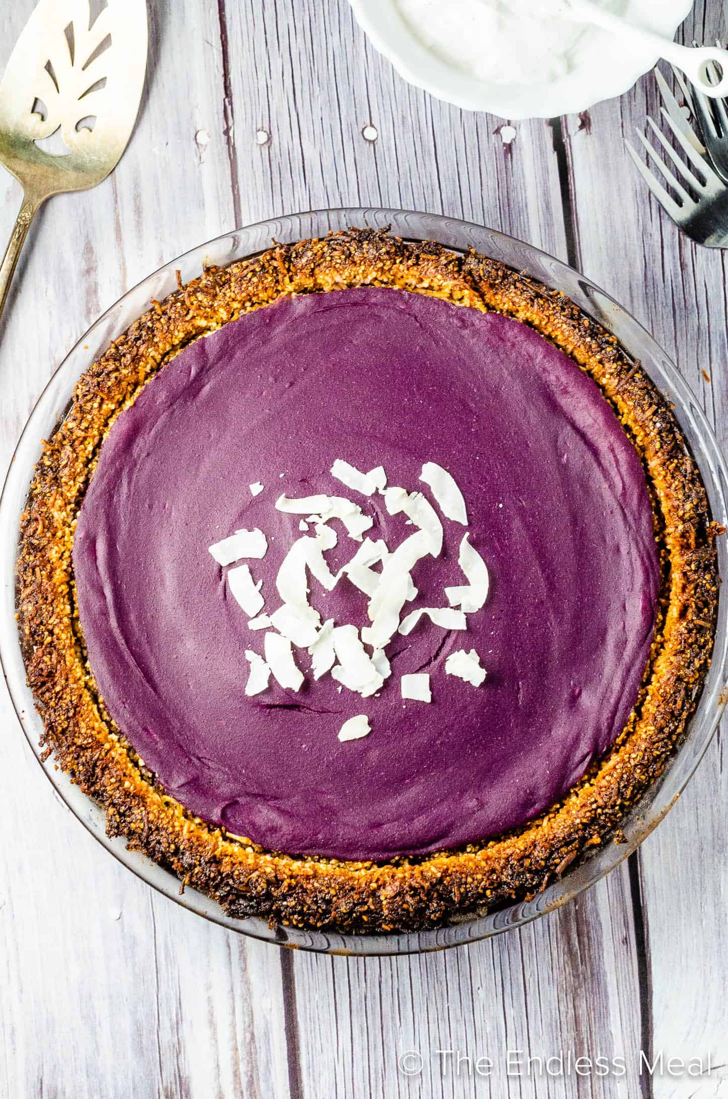 Vegan Purple Sweet Potato Pie with coconut sprinkled on top
