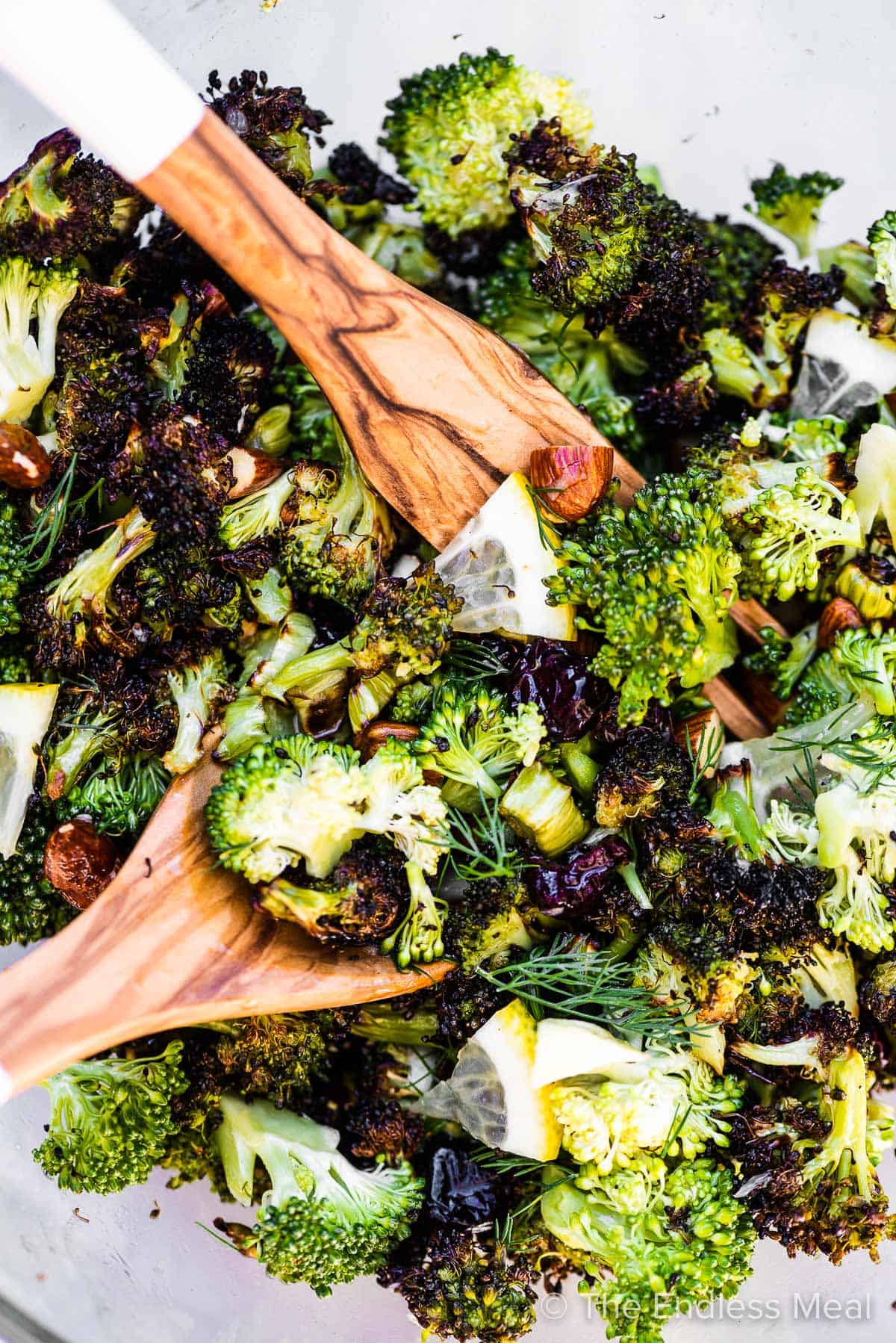 Roasted broccoli salad in a glass bowl.