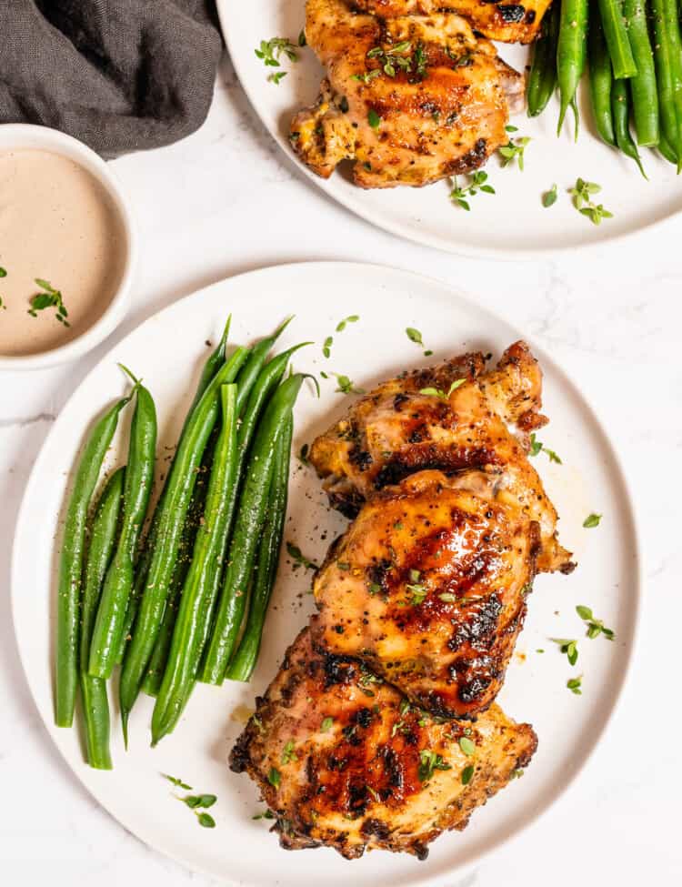 Grilled Mustard Chicken on a dinner plate with green beans