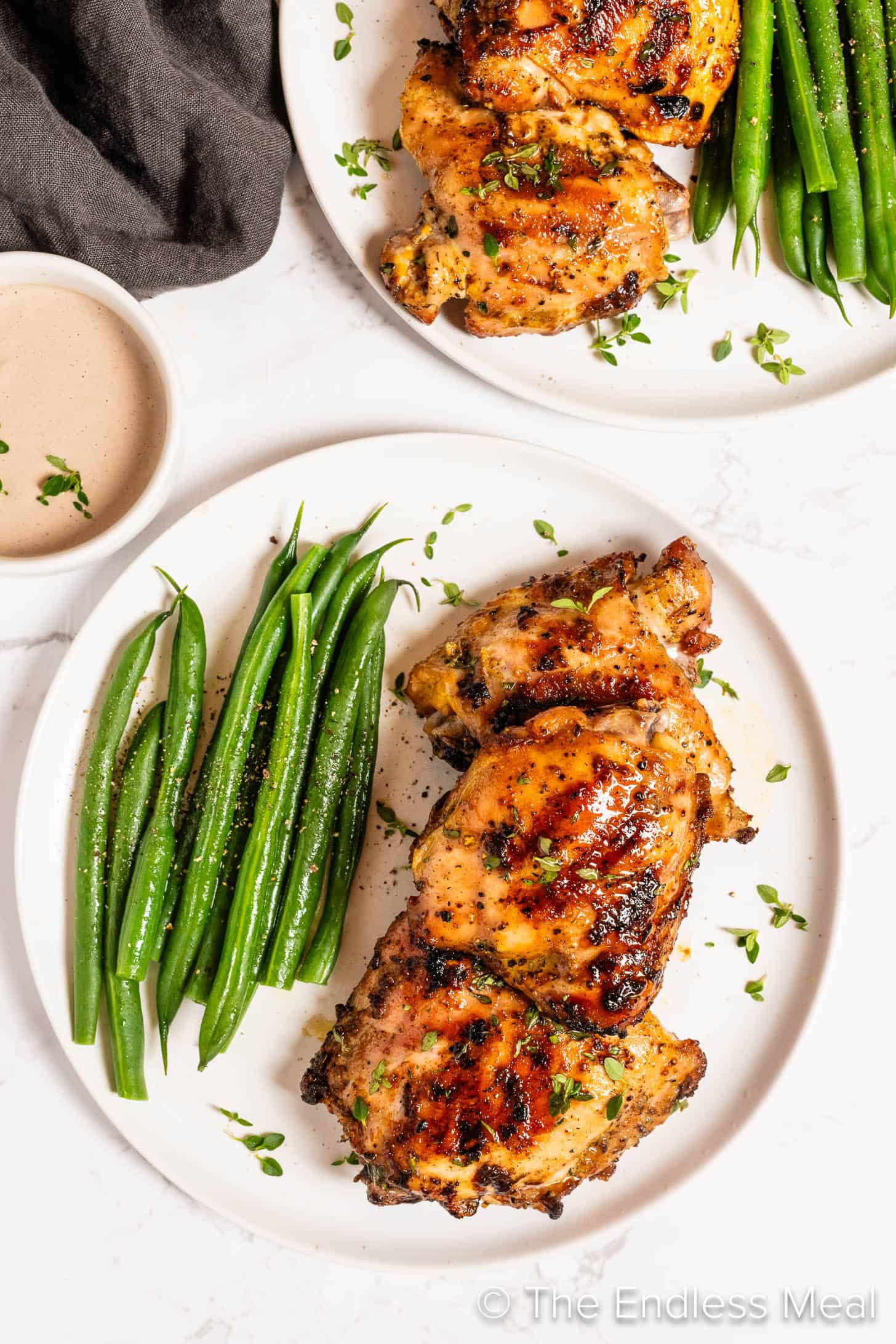 Grilled Mustard Chicken on a dinner plate with green beans