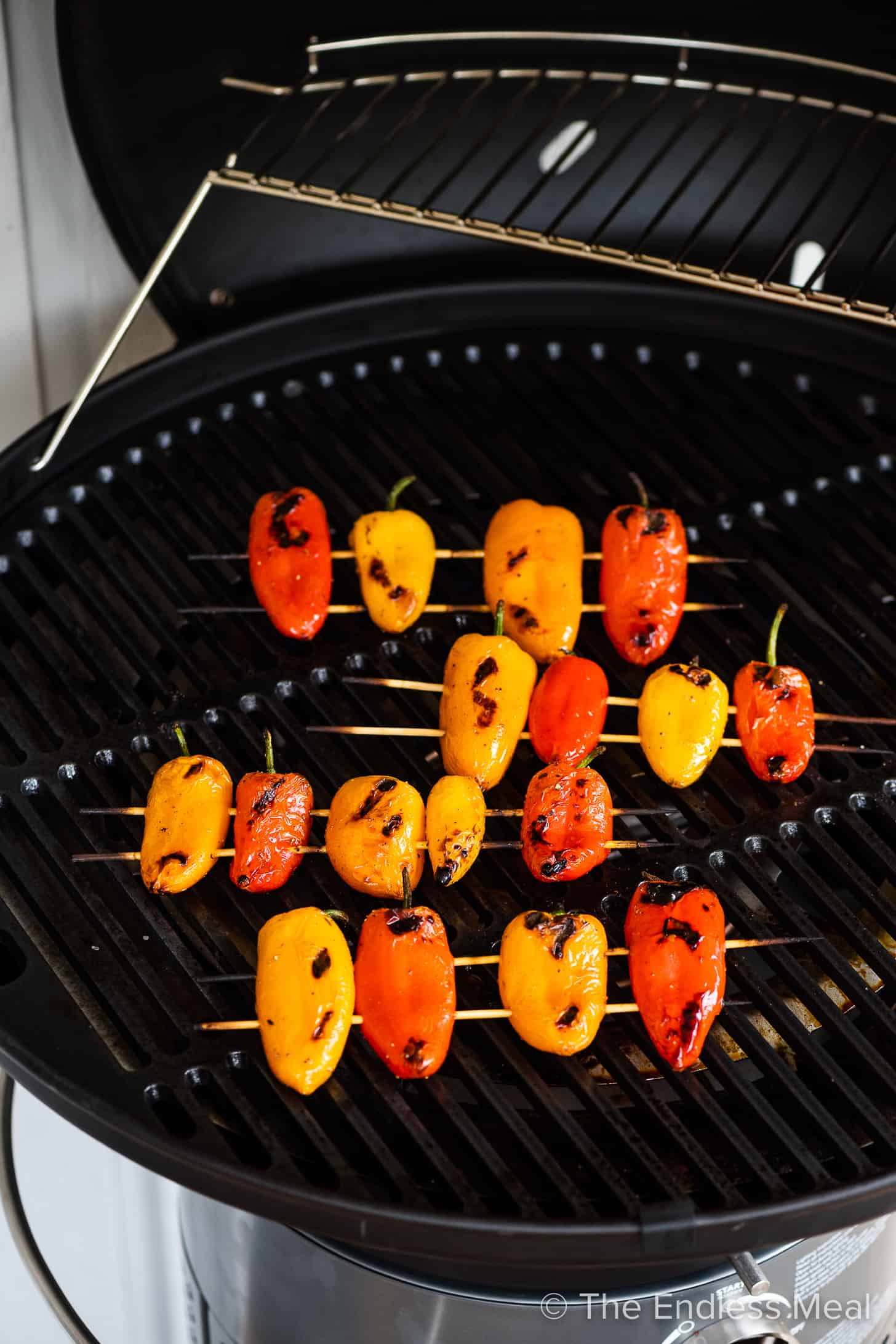 mini peppers being grilled on a bbq