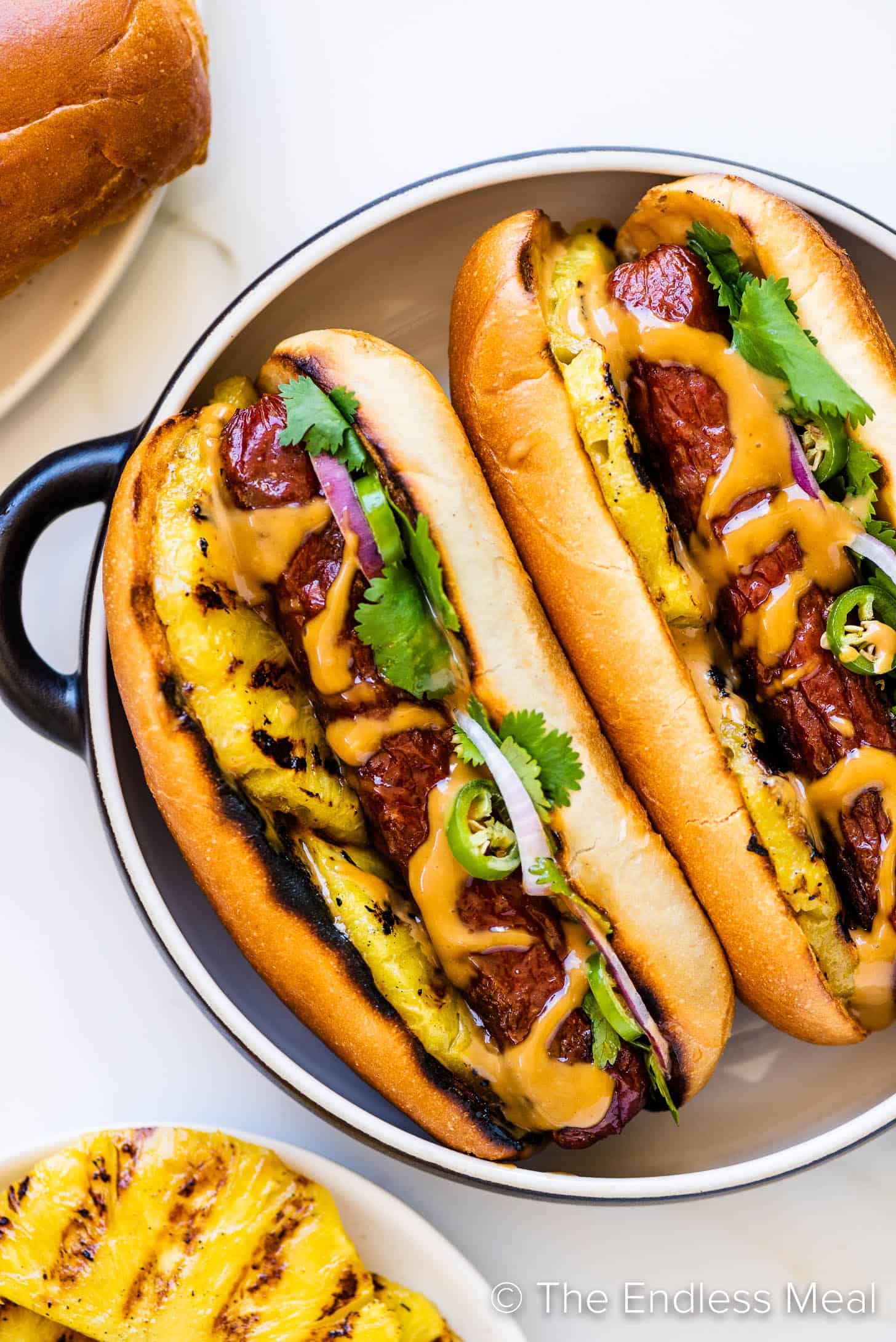 two Hawaiian Hot Dogs on a plate