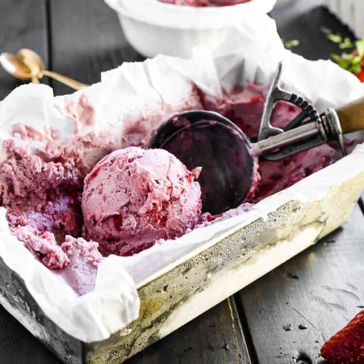 Vegan Strawberry Ice Cream in a freezer container