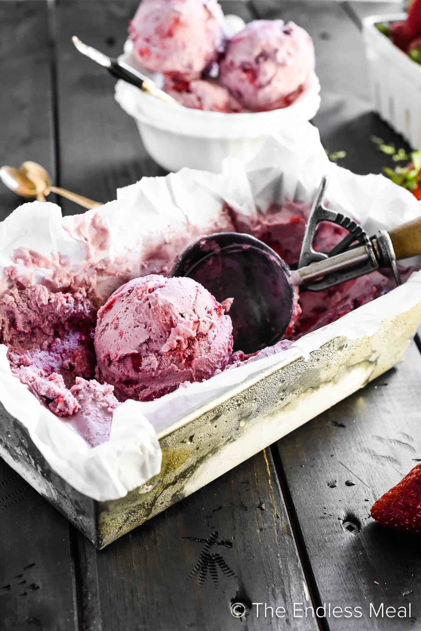 Vegan Strawberry Ice Cream in a freezer container