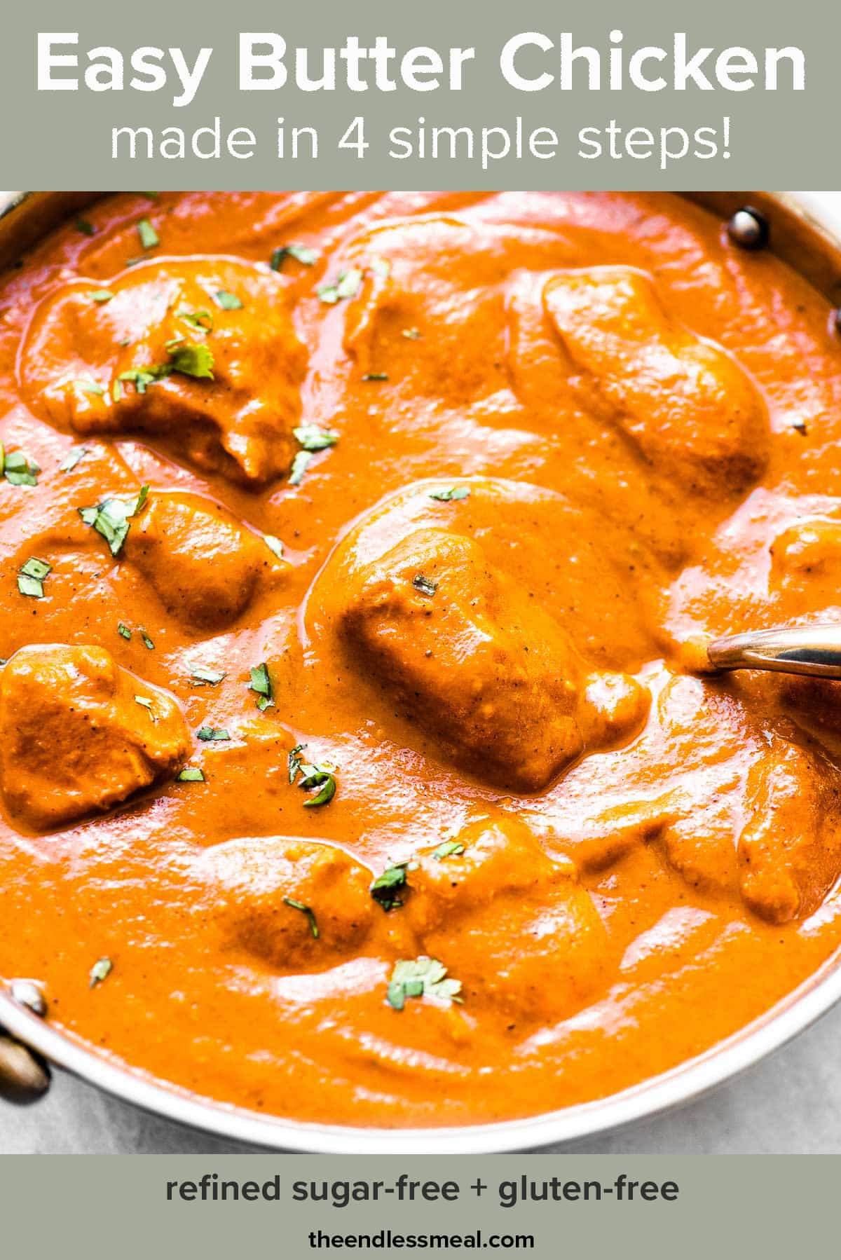 Butter chicken in an Indian pot with the recipe title on top of the picture.