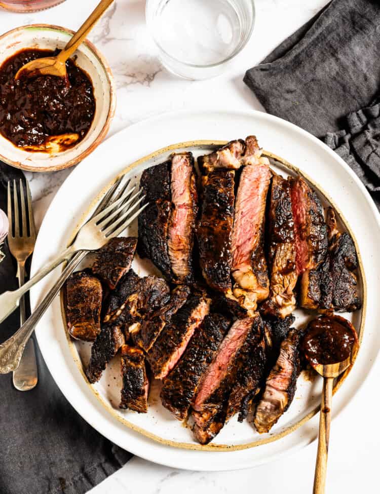 Bourbon Steak sliced on a dinner serving plate