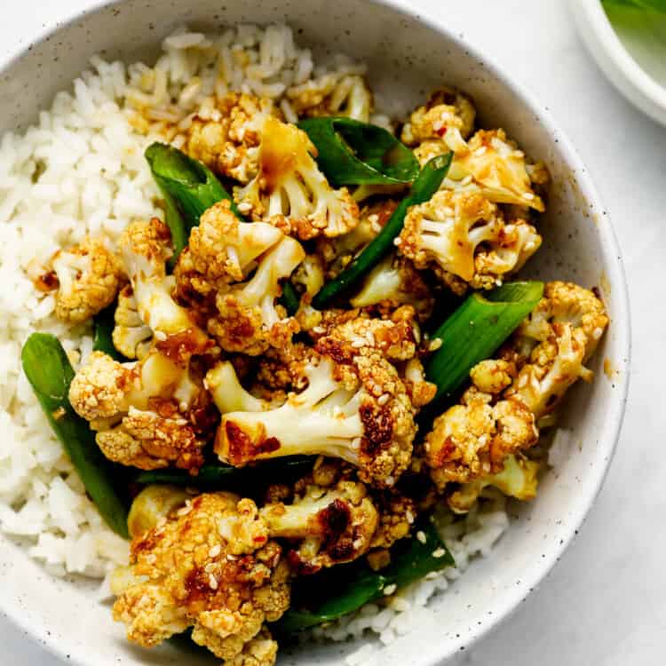 General Tso's Cauliflower in a dinner bowl with rice