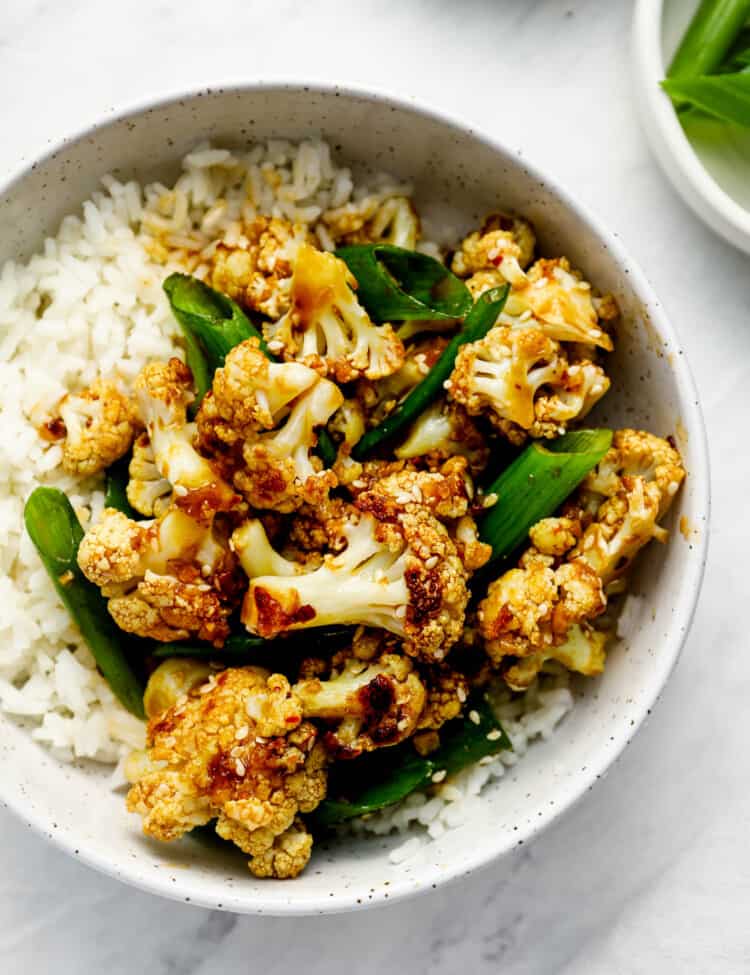 General Tso's Cauliflower in a dinner bowl with rice