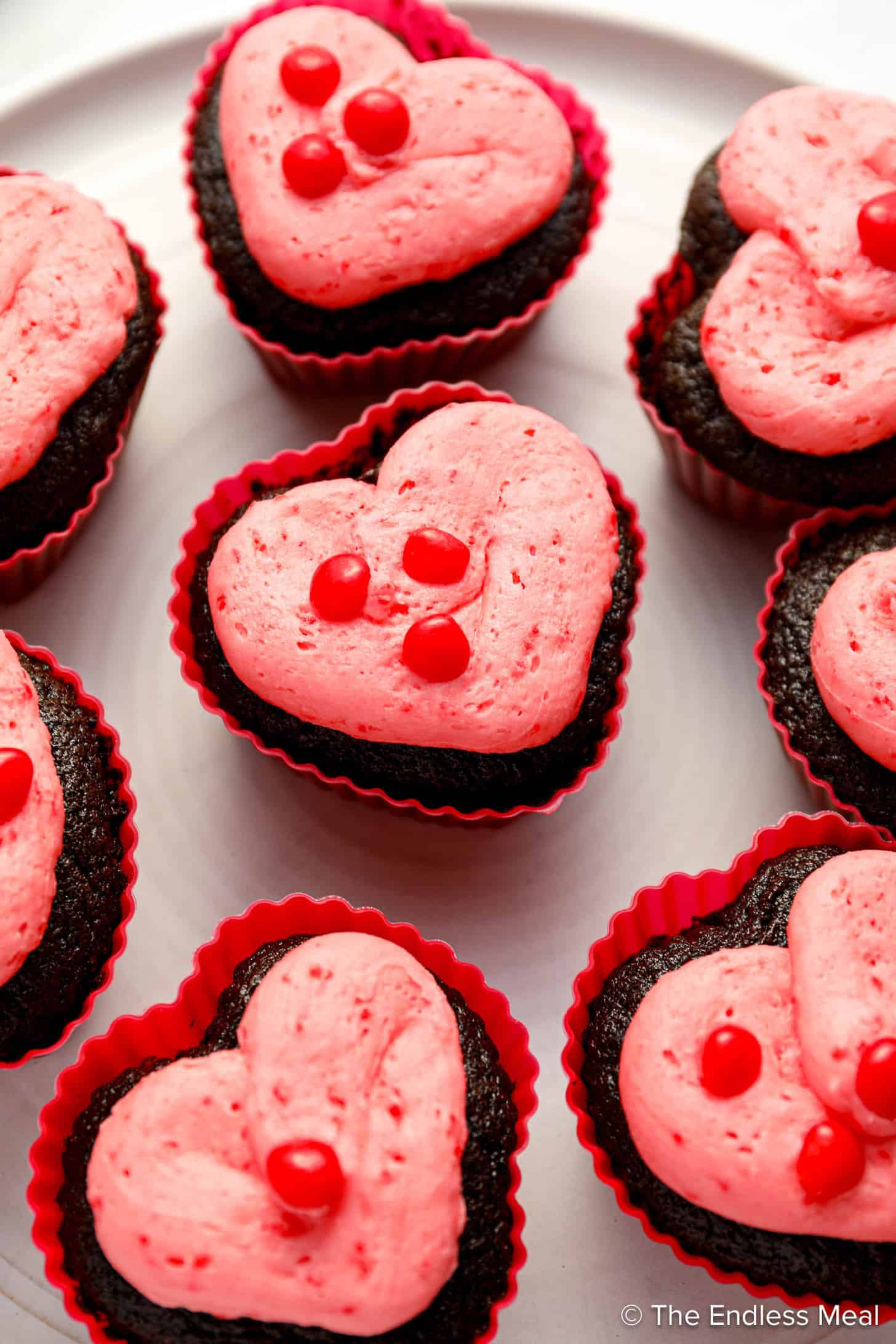 Heart Shaped Valentine's Day Cupcakes in red silicone cupcake liners