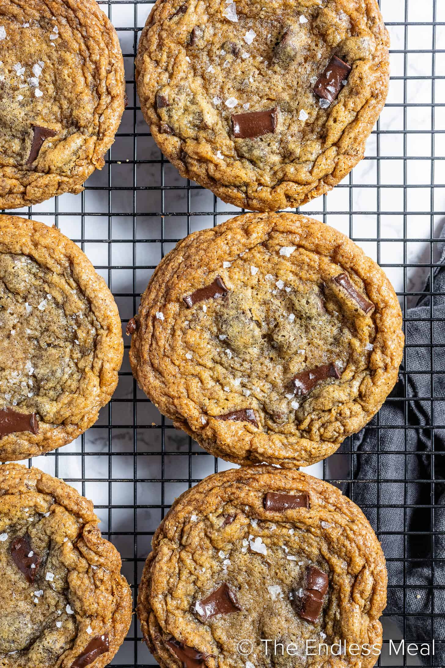 Brown Butter Sea Salt Chocolate Chip Cookies on a wire rack