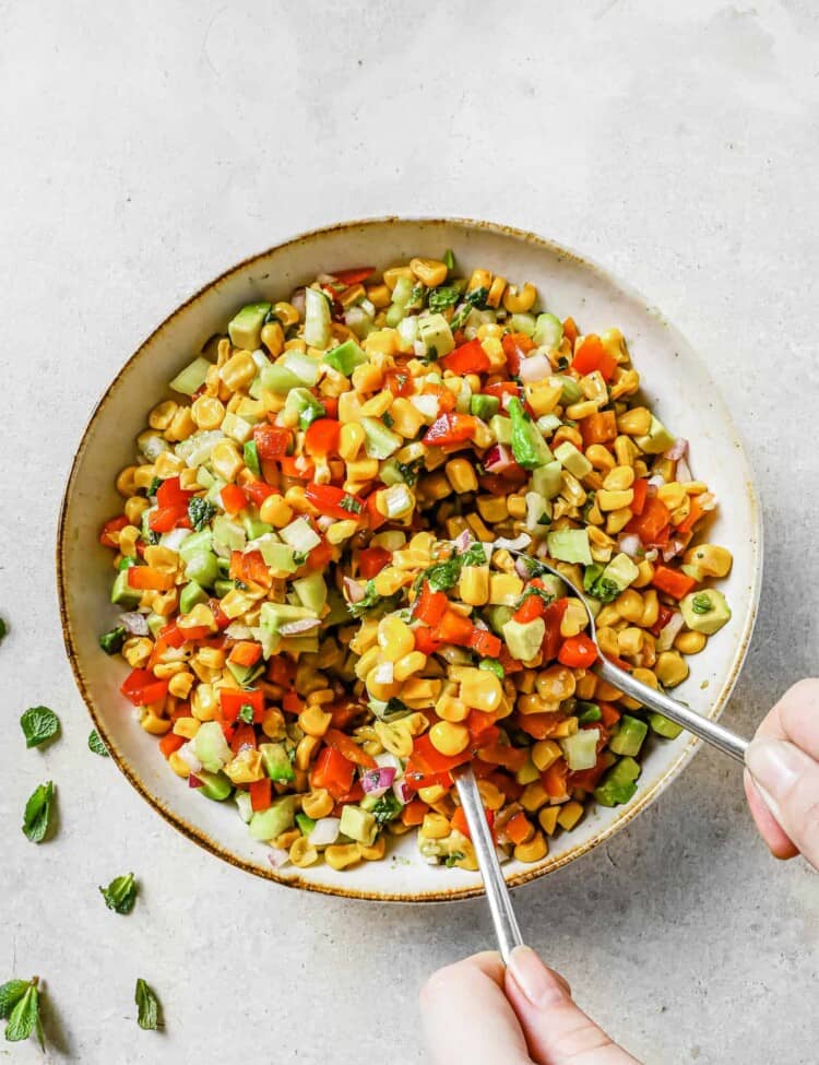corn salad with avocado in a bowl