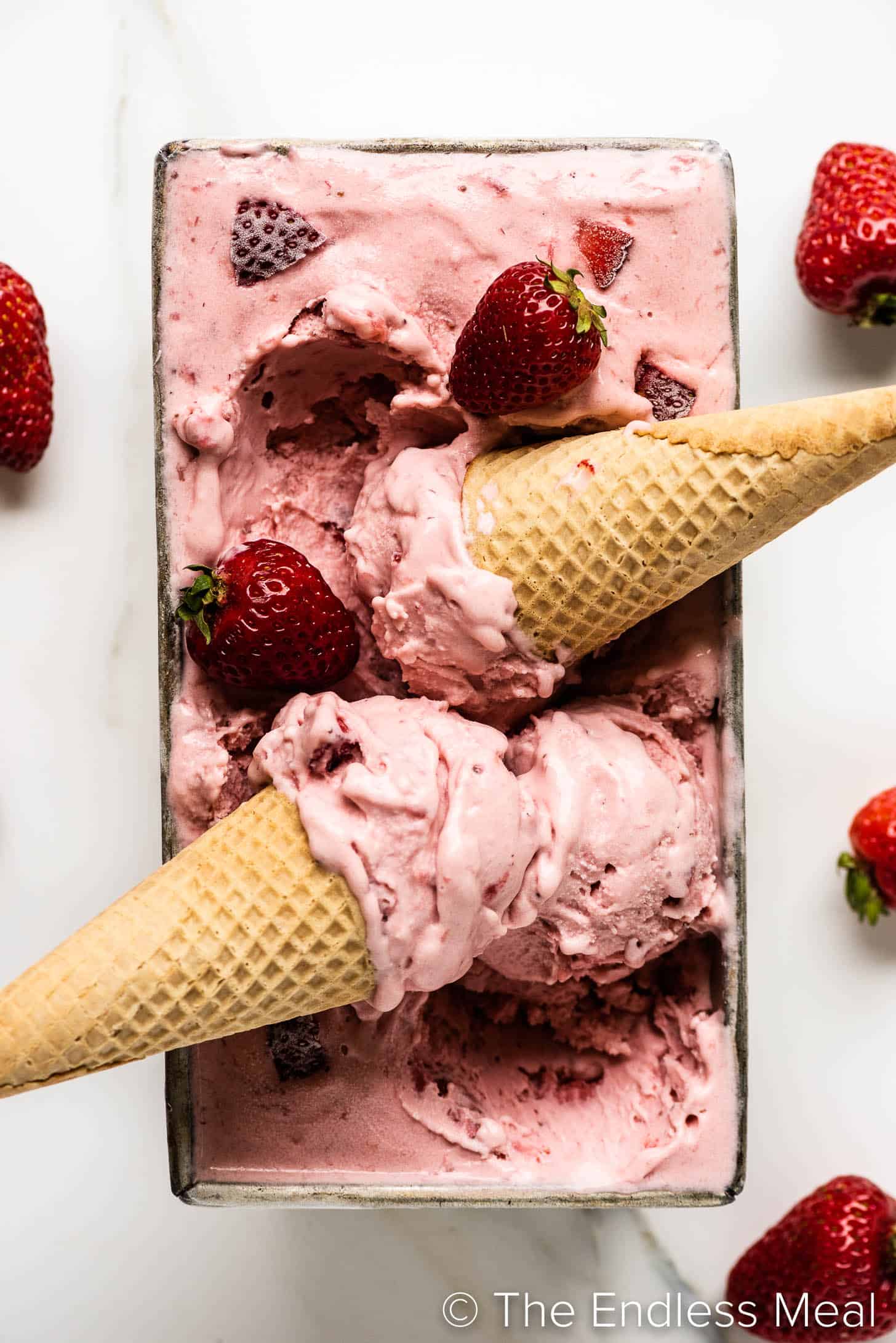 2 strawberry ice cream cones