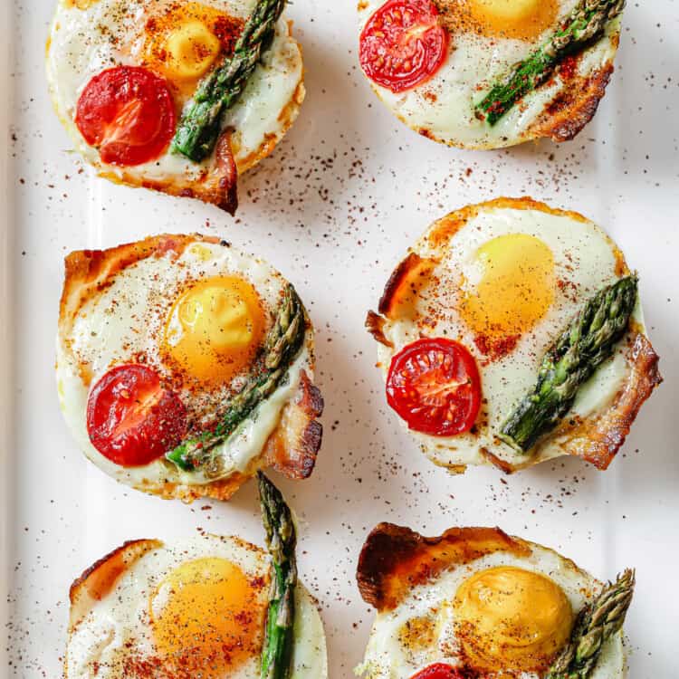 bacon and egg and cheese breakfast cups on a plate