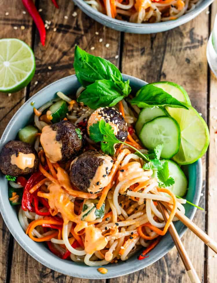 Looking down on a Banh Mi Noodle Bowl with chopsticks