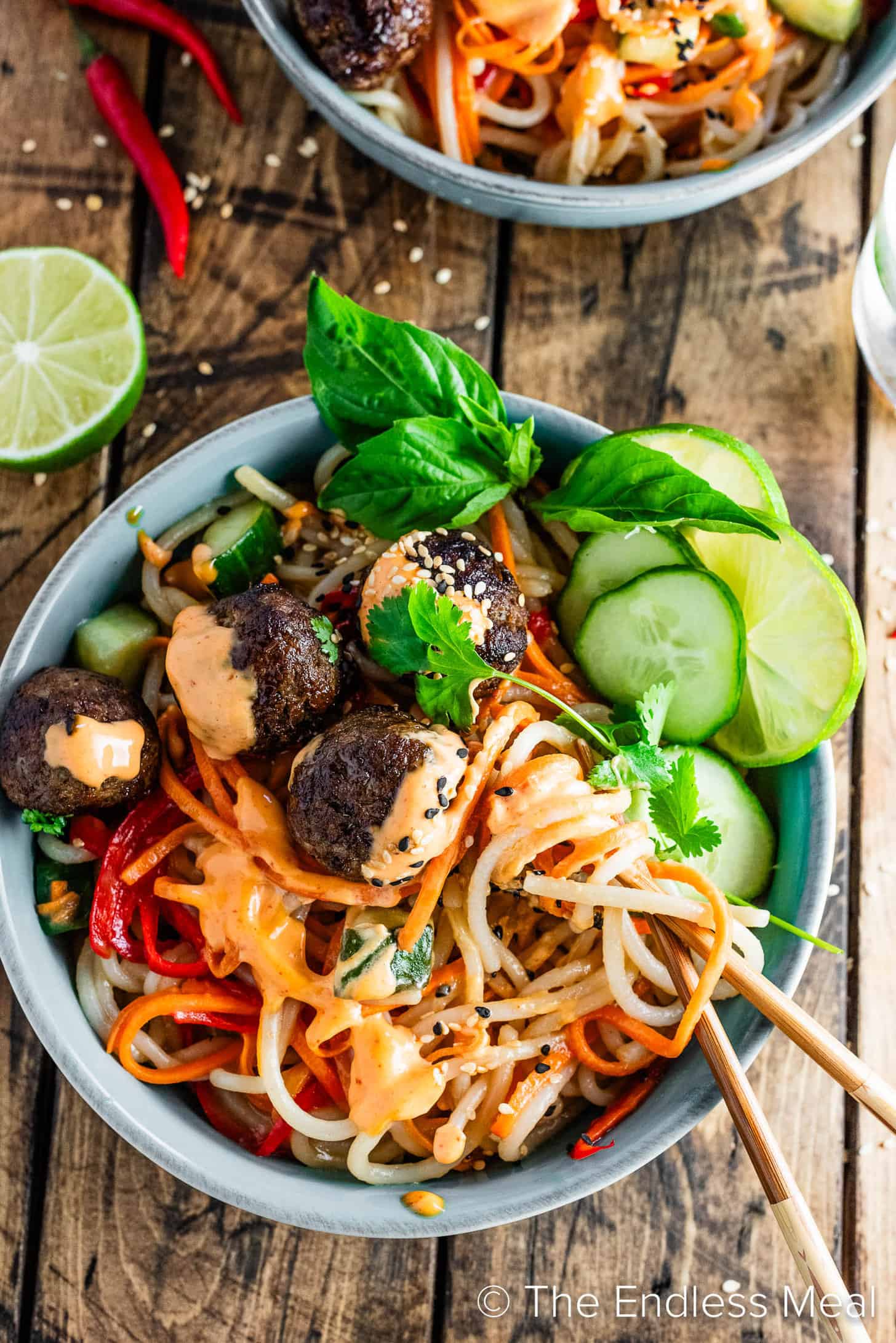 Looking down on a Banh Mi Noodle Bowl with chopsticks