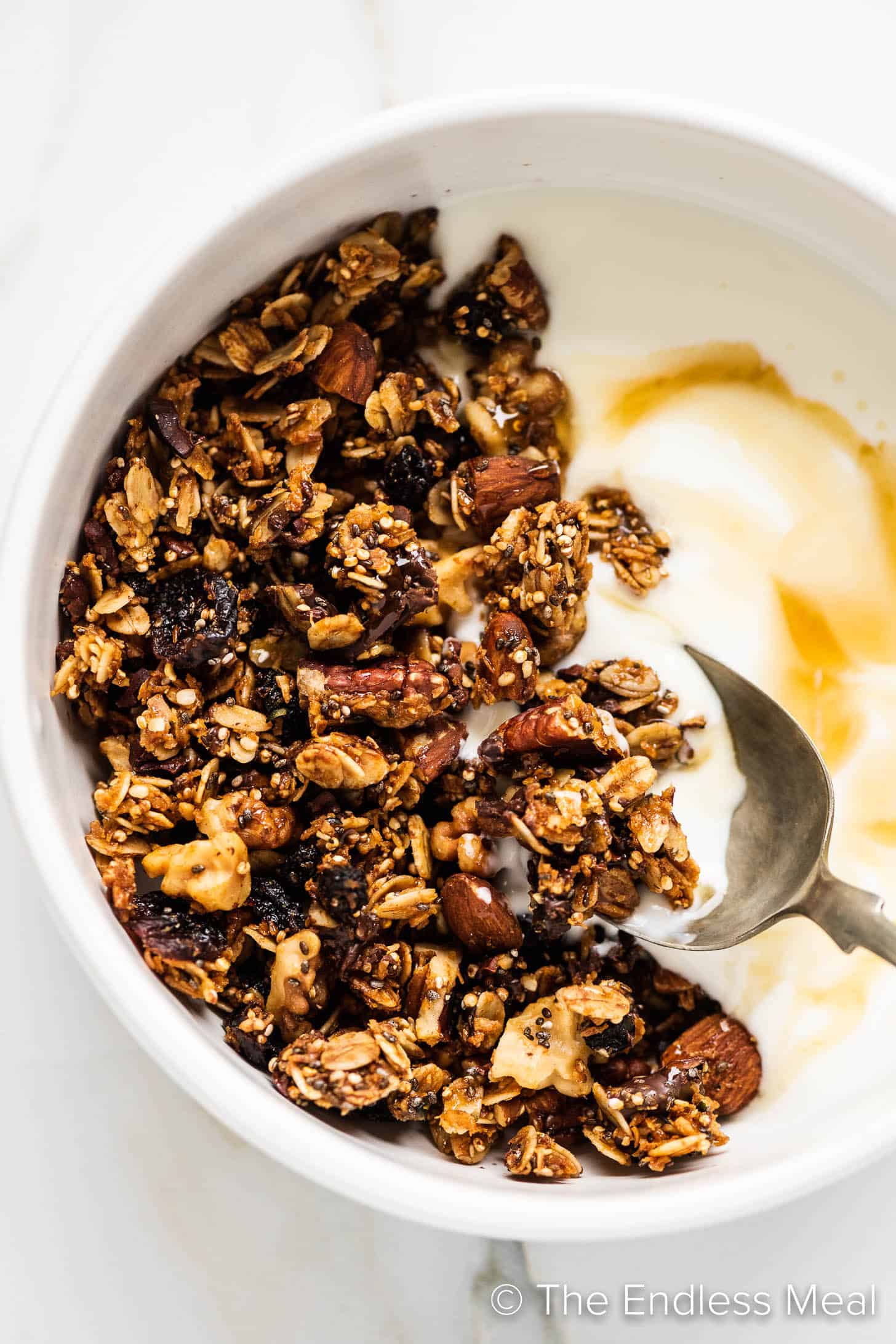 a breakfast bowl of Superfood Granola and yogurt