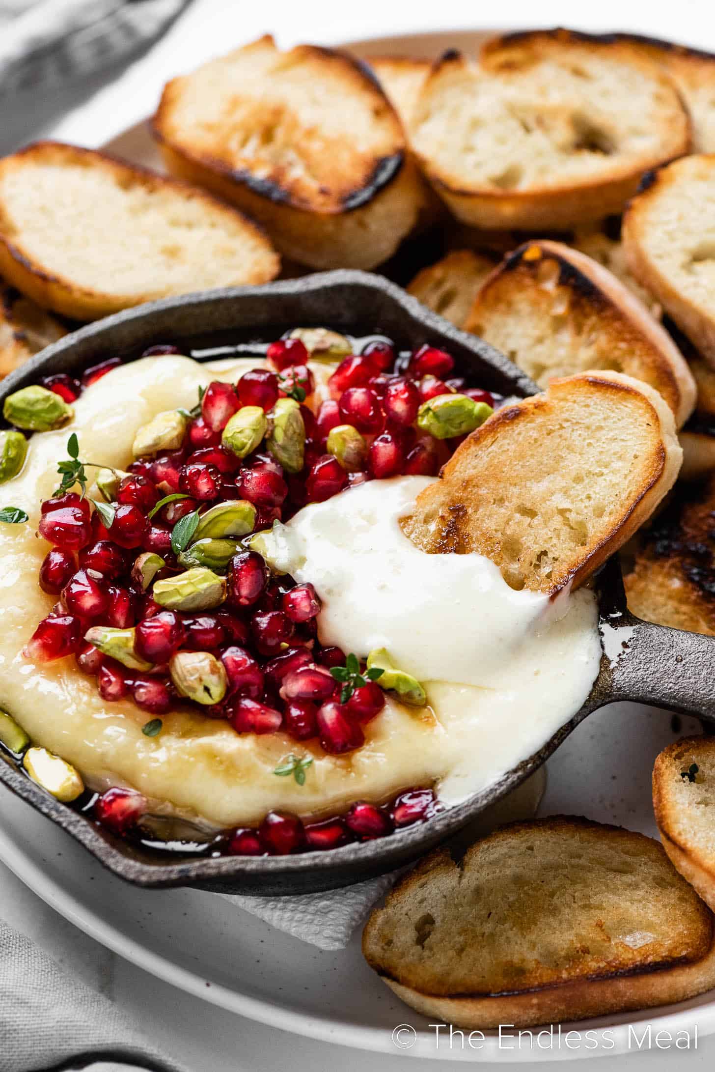 Pomegranate Baked Brie on a plate